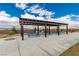 Covered picnic and BBQ area with mountain views and desert landscaping at 5615 Distelrath Ave, Las Vegas, NV 89122