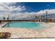 Community pool with clear blue water and desert mountain views at 5615 Distelrath Ave, Las Vegas, NV 89122
