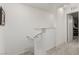 Clean and bright staircase leading to the upper level of the home at 5615 Distelrath Ave, Las Vegas, NV 89122