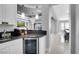 Modern bar featuring a sleek countertop, beverage cooler, and open view to the living area at 5812 Shangri La Night Ct, Las Vegas, NV 89149