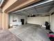 Well-organized garage with ample storage cabinets and plenty of space for parking and projects at 5812 Shangri La Night Ct, Las Vegas, NV 89149