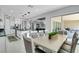 Spacious kitchen with an island adjacent to the dining area and a view of the living room at 5812 Shangri La Night Ct, Las Vegas, NV 89149