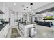Modern kitchen featuring an island and open floorplan concept that flows into the living space at 5812 Shangri La Night Ct, Las Vegas, NV 89149