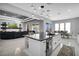 Open concept kitchen island overlooking the living room and dining area at 5812 Shangri La Night Ct, Las Vegas, NV 89149