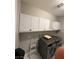 This laundry room is equipped with modern appliances and plenty of storage at 5812 Shangri La Night Ct, Las Vegas, NV 89149