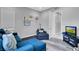 Inviting living room showcasing a blue sofa, artwork, and stylish decor at 5812 Shangri La Night Ct, Las Vegas, NV 89149