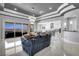 Spacious living room with open floor plan, modern lighting, and access to outdoor patio at 5812 Shangri La Night Ct, Las Vegas, NV 89149