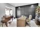 Well-lit office space with dark accent wall and modern furniture at 5812 Shangri La Night Ct, Las Vegas, NV 89149