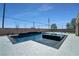 Beautiful pool featuring dark tile, modern patio, and well-maintained backyard at 5812 Shangri La Night Ct, Las Vegas, NV 89149