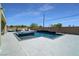 Inviting backyard featuring a modern pool, stylish patio, and comfortable lounge area at 5812 Shangri La Night Ct, Las Vegas, NV 89149
