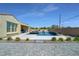Stunning backyard featuring a modern pool, stylish patio, and lush landscaping at 5812 Shangri La Night Ct, Las Vegas, NV 89149