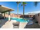 Beautiful backyard with a pool, spa, and desert landscaping, ideal for relaxation at 6220 Silver Edge St, North Las Vegas, NV 89031