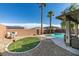 Resort-style backyard with putting green, pool, and covered patio, great for entertaining at 6220 Silver Edge St, North Las Vegas, NV 89031
