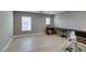 This bonus bedroom features wood-look floors and ample room for a desk or seating area at 6220 Silver Edge St, North Las Vegas, NV 89031