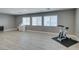Versatile bonus room with laminate floors, filled with natural light, ideal for a home gym or play area at 6220 Silver Edge St, North Las Vegas, NV 89031