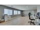 Spacious bonus room features multiple windows providing ample natural light and wood-look floors at 6220 Silver Edge St, North Las Vegas, NV 89031
