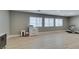 Well-lit bonus room with laminate flooring, suitable for a home gym or entertainment area. Natural light streams through windows at 6220 Silver Edge St, North Las Vegas, NV 89031