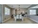 Open dining area features a modern chandelier and a cozy fireplace, perfect for gatherings at 6220 Silver Edge St, North Las Vegas, NV 89031