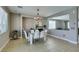 Spacious dining area with a modern table and chairs next to a cozy living space at 6220 Silver Edge St, North Las Vegas, NV 89031
