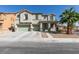 Traditional two-story home with a three-car garage and well-maintained front yard landscaping at 6220 Silver Edge St, North Las Vegas, NV 89031