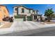 Charming two-story home with a three-car garage, well-maintained lawn and inviting curb appeal at 6220 Silver Edge St, North Las Vegas, NV 89031