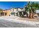 Attractive two-story home with a three-car garage, desert landscaping, and a covered entry at 6220 Silver Edge St, North Las Vegas, NV 89031