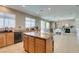Spacious kitchen with granite island that opens to the dining and living area, perfect for entertaining at 6220 Silver Edge St, North Las Vegas, NV 89031