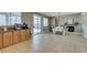 Spacious kitchen and dining area with pool views, seamlessly connected with wood cabinetry and modern appliances at 6220 Silver Edge St, North Las Vegas, NV 89031