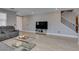 Bright living room showcasing cozy sofas, modern flooring, and ample space for entertaining at 6220 Silver Edge St, North Las Vegas, NV 89031
