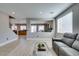 Open living room with tile floors and cozy seating, creating a welcoming atmosphere at 6220 Silver Edge St, North Las Vegas, NV 89031