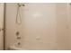Bathroom featuring a shower-tub combo with white tiles and chrome fixtures at 6700 Amarinta Ave # 104, Las Vegas, NV 89108