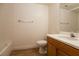 Bathroom with a shower-tub combo, toilet, and a single sink vanity with wood cabinets at 6700 Amarinta Ave # 104, Las Vegas, NV 89108