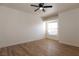 Inviting bedroom with wood flooring, ceiling fan, and natural light, creating a cozy retreat at 6700 Amarinta Ave # 104, Las Vegas, NV 89108