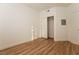 Bedroom with wood-look flooring, closet, and neutral wall color at 6700 Amarinta Ave # 104, Las Vegas, NV 89108