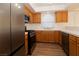 The bright kitchen features stainless appliances, light countertops, and a functional layout for culinary enthusiasts at 6700 Amarinta Ave # 104, Las Vegas, NV 89108