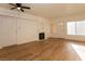 Bright living room featuring new laminate flooring and cozy fireplace at 6700 Amarinta Ave # 104, Las Vegas, NV 89108
