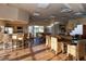 Bright community living room featuring wood floors, counter seating and natural lighting at 6700 Amarinta Ave # 104, Las Vegas, NV 89108