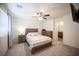 Comfortable bedroom featuring neutral walls, carpeted floors and modern ceiling fan at 6913 Evening Orchid St, North Las Vegas, NV 89086