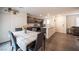 Inviting dining area flows into a modern kitchen and a comfortable living room at 6913 Evening Orchid St, North Las Vegas, NV 89086