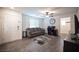 Inviting living room with a comfortable sofa, ceiling fan, and stylish decor at 6913 Evening Orchid St, North Las Vegas, NV 89086