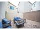 Private patio features a cozy seating arrangement with a fire pit, perfect for outdoor gatherings at 6913 Evening Orchid St, North Las Vegas, NV 89086