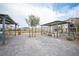 A community pavilion with pavers and multiple metal shade structures with built in benches and landscaping at 6913 Evening Orchid St, North Las Vegas, NV 89086
