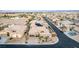 Exterior view of a house featuring solar panels, desert landscaping, and a circular driveway in a residential neighborhood at 7682 Rafter Ct, Las Vegas, NV 89139