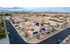 Exterior of a home with solar panels, desert landscaping, a backyard oasis with a pool and a putting green at 7682 Rafter Ct, Las Vegas, NV 89139
