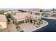 Beautiful aerial view of the house showing its desert landscaping, solar panels, and well-kept front yard with mature palm trees at 7682 Rafter Ct, Las Vegas, NV 89139