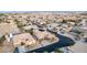 Expansive aerial view showcases a neighborhood with desert landscaping, tile roofs, and spacious single-Gathering homes at 7682 Rafter Ct, Las Vegas, NV 89139