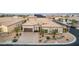 Stunning aerial view of the house, displaying its manicured front yard, a three-car garage, and a beautifully landscaped yard at 7682 Rafter Ct, Las Vegas, NV 89139