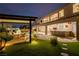 A luxurious backyard featuring a pool, outdoor bar and lush green lawn perfect for entertaining at 7682 Rafter Ct, Las Vegas, NV 89139