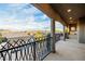Elegant balcony offers panoramic neighborhood views, complemented by stylish wrought iron railing at 7682 Rafter Ct, Las Vegas, NV 89139