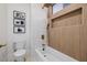 Modern bathroom showcases a soaking tub, sleek fixtures, and stylish wall art at 7682 Rafter Ct, Las Vegas, NV 89139